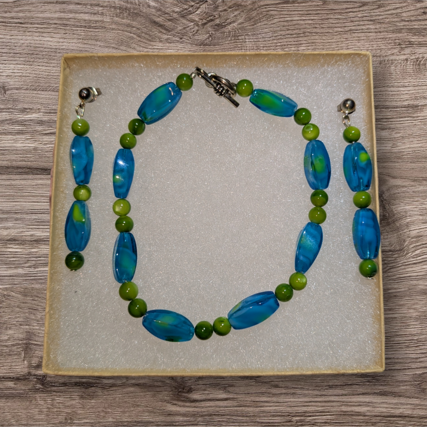 Blue and green beaded bracelet and earring set.