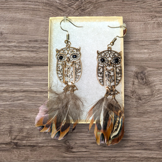 Owl dangle earrings with feathered tail.