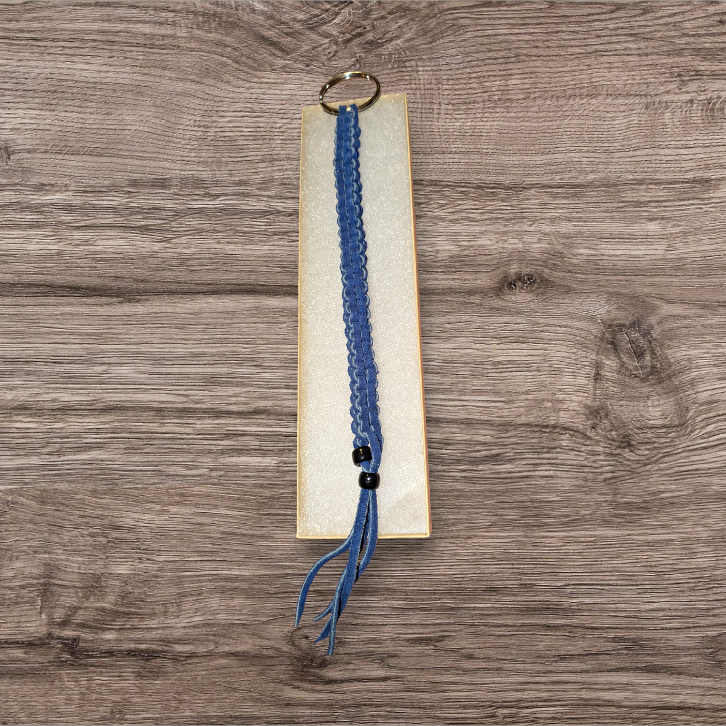 Long blue box braided leather keychain