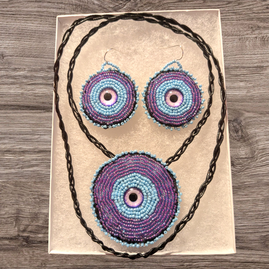 Hand beaded dragon eye medallion set with matching earrings.